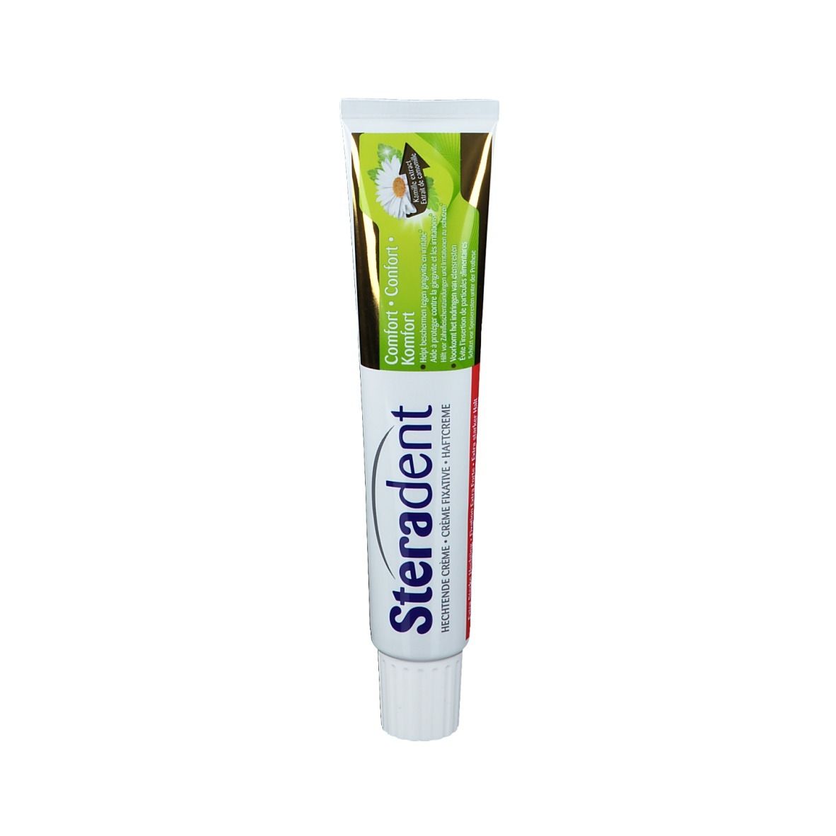 Tube de crème dentaire avec bouchon blanc. Inscription: Steradent, Comfort. Emballage vert et blanc avec fleur de camomille.