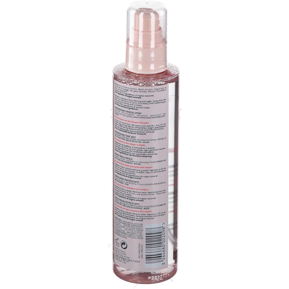Transparante fles met roze dop en verstuiver. Tekst op de achterkant in verschillende talen.