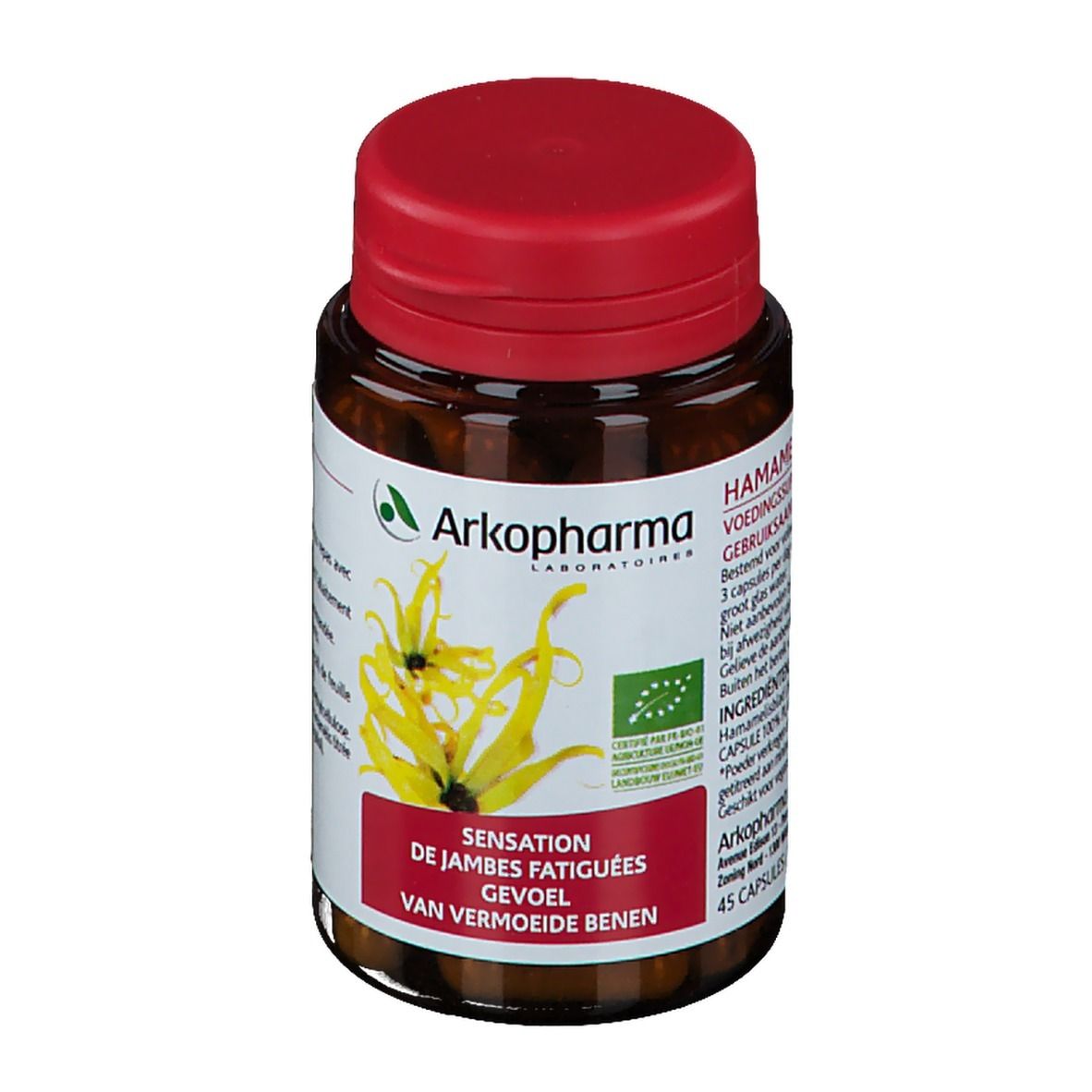 Bruine glazen fles met rode dop. Etiket met productinfo en hamamelisbloemen. Bio-certificering.