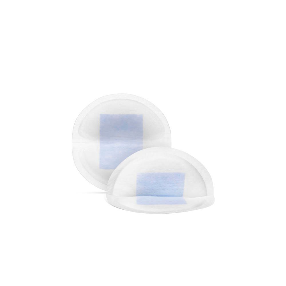 Twee ronde, witte zoogcompressen met blauwe kern. Close-up.