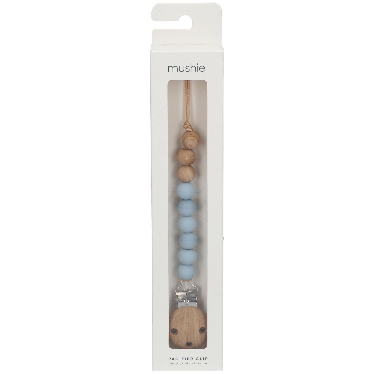 Schnullerkette in Verpackung. Holz- und blaue Silikonperlen, Holzclip. Marke: mushie. "PACIFIER CLIP" steht unten.