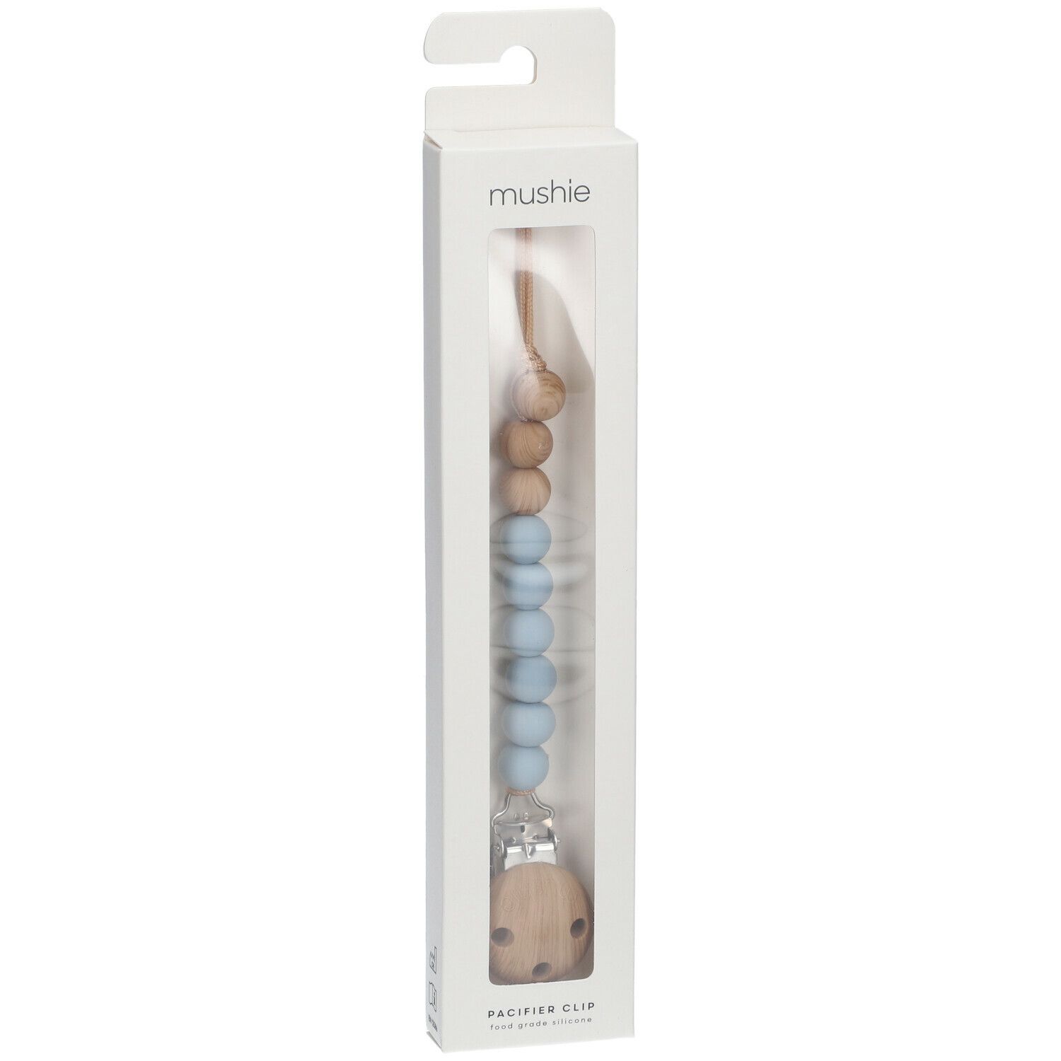 Schnullerkette in Verpackung. Holz- und blaue Silikonperlen, Holzclip. Marke: mushie. "PACIFIER CLIP" steht unten.
