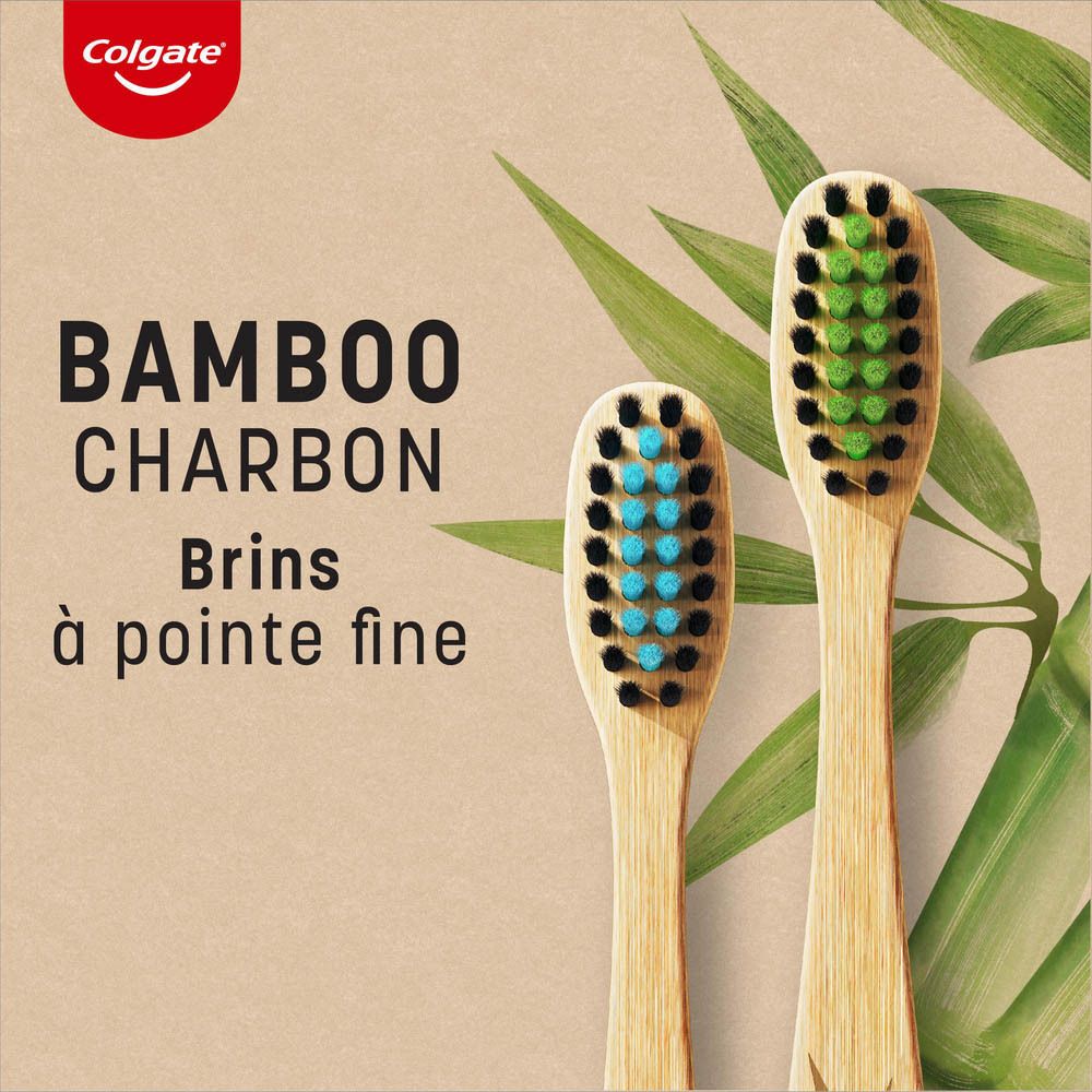 Brosse à dents Colgate en bambou. Soies bleues, manche en bambou, emballage. Texte: Bamboo Charcoal.