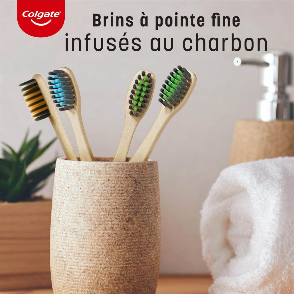 Brosse à dents Colgate en bambou. Soies bleues, manche en bambou, emballage. Texte: Bamboo Charcoal, certification FSC.