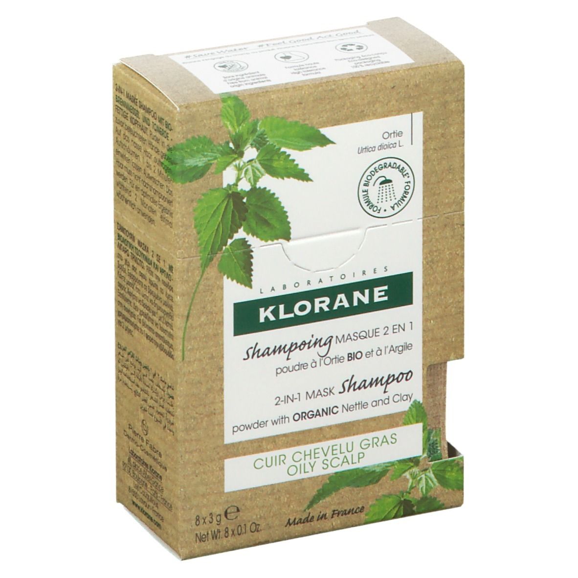 Klorane shampoo verpakking. Doos met productinfo en brandnetel illustratie. Bevat 8 x 3g shampoo sticks.