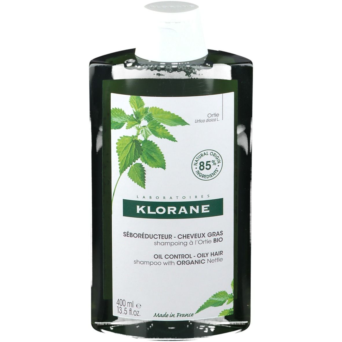Flacon de shampooing Klorane. Étiquette verte et blanche avec illustration d'ortie. Texte: Seboréducteur, Oil Control, 400 ml.
