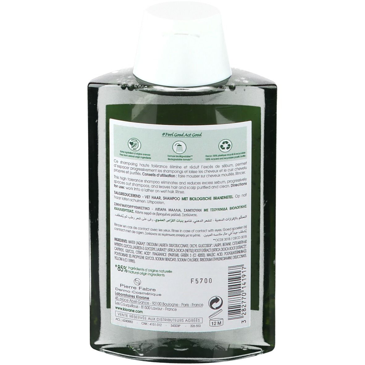 Achterkant Klorane shampoo fles. Meertalige tekst. 85% natuurlijke ingrediënten. Recycling logo.
