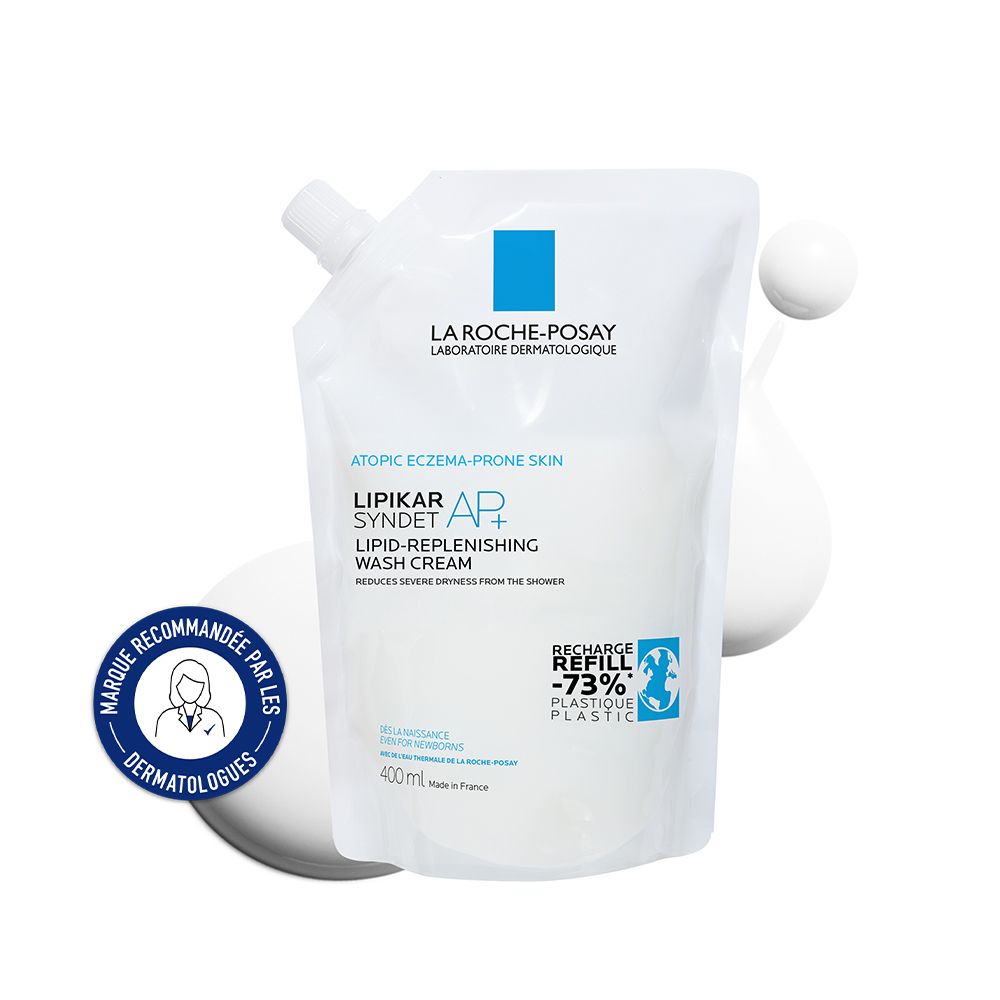 Recharge de gel douche. Sachet blanc avec informations produit et logo. « Recommandé par les dermatologues ».