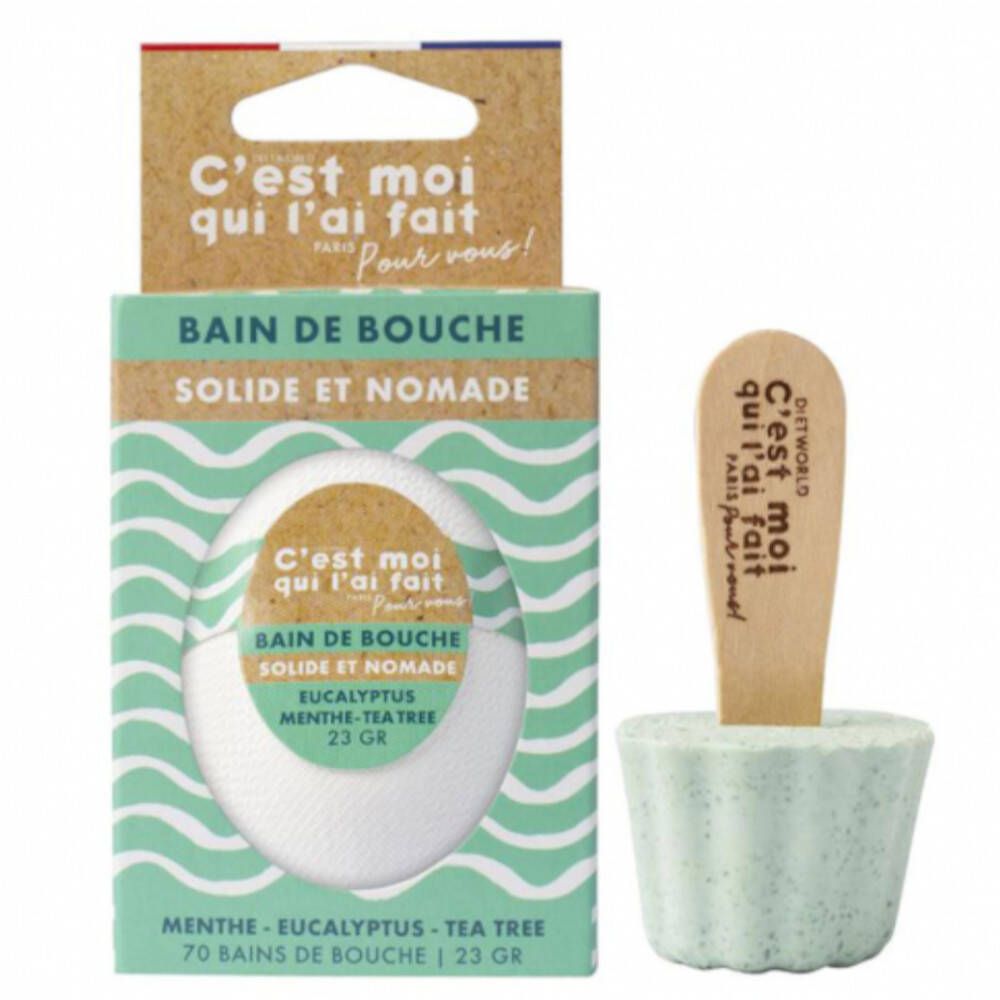 Mondverzorgingsproduct in vaste vorm en verpakking. Bevat een houten applicator. Tekst: Bain de bouche solide et nomade.