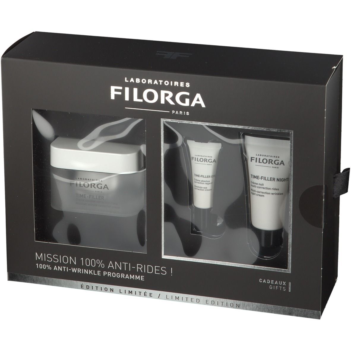 Schwarze Geschenkbox mit drei Produkten. Sichtbar: Creme-Tiegel, zwei Tuben. Schriftzug: FILORGA, TIME-FILLER.