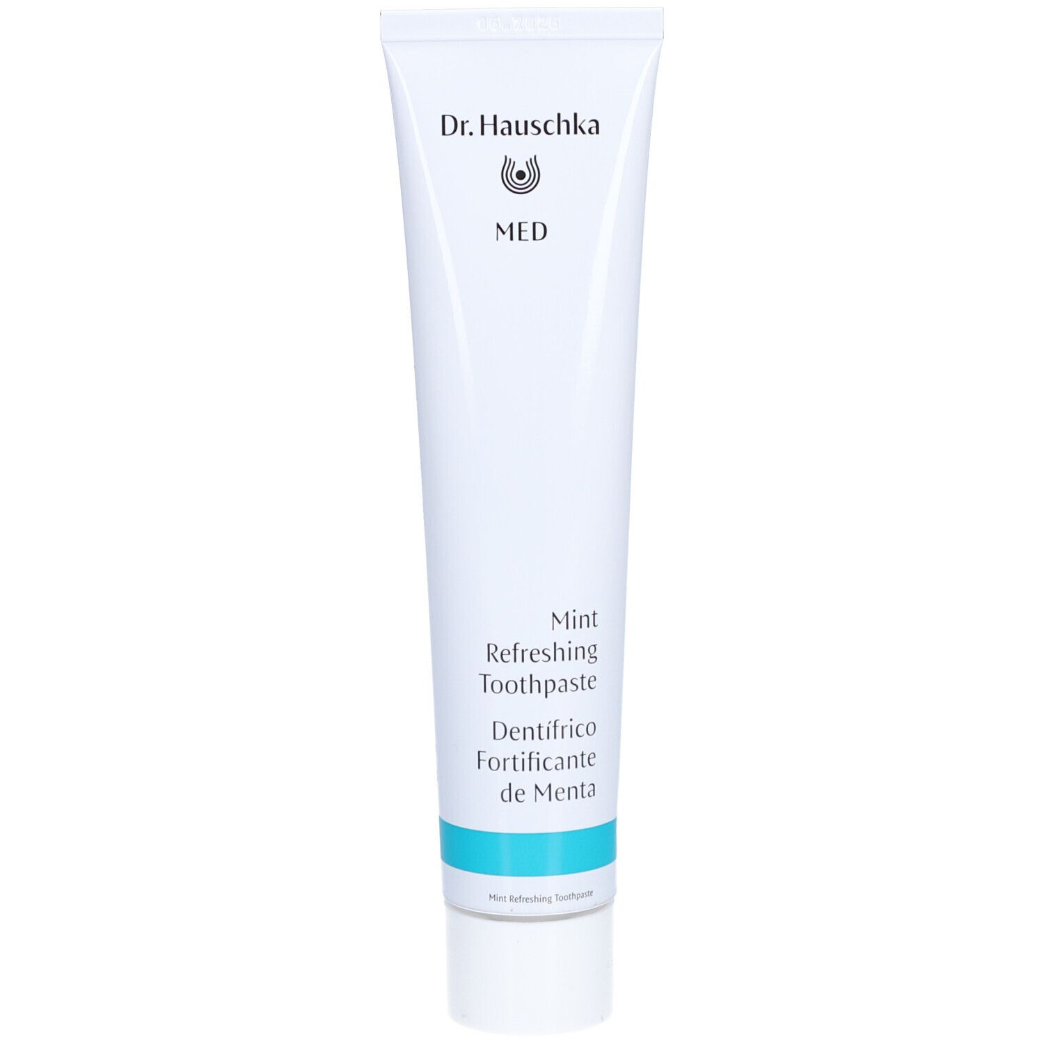 Tandpastatube van Dr. Hauschka. Wit, met blauwe tekst en logo. Opschrift: MED, Mint Refreshing Toothpaste, Dentifrico de Menta.