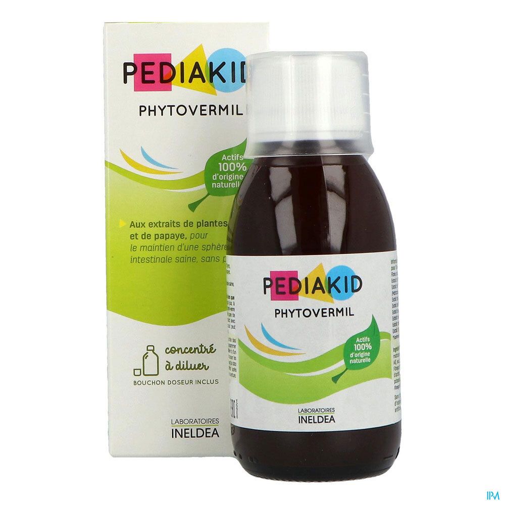 Liquide brun dans une bouteille avec bouchon blanc. Inscription : PEDIAKID PHYTOVERMIL. Emballage en arrière-plan.