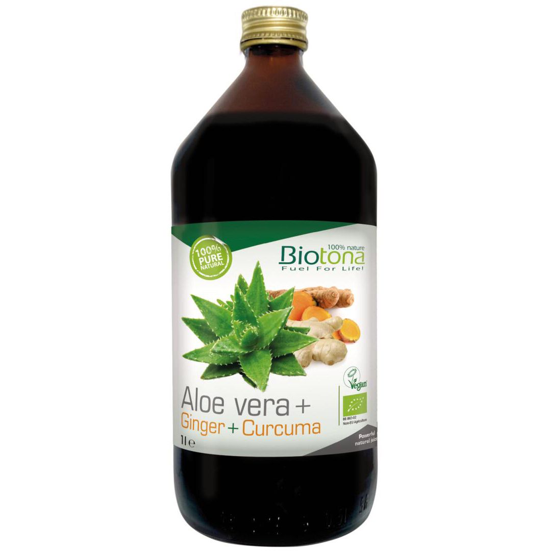 Bouteille en verre brun avec bouchon doré. Étiquette avec aloe vera, gingembre et curcuma. Label bio.