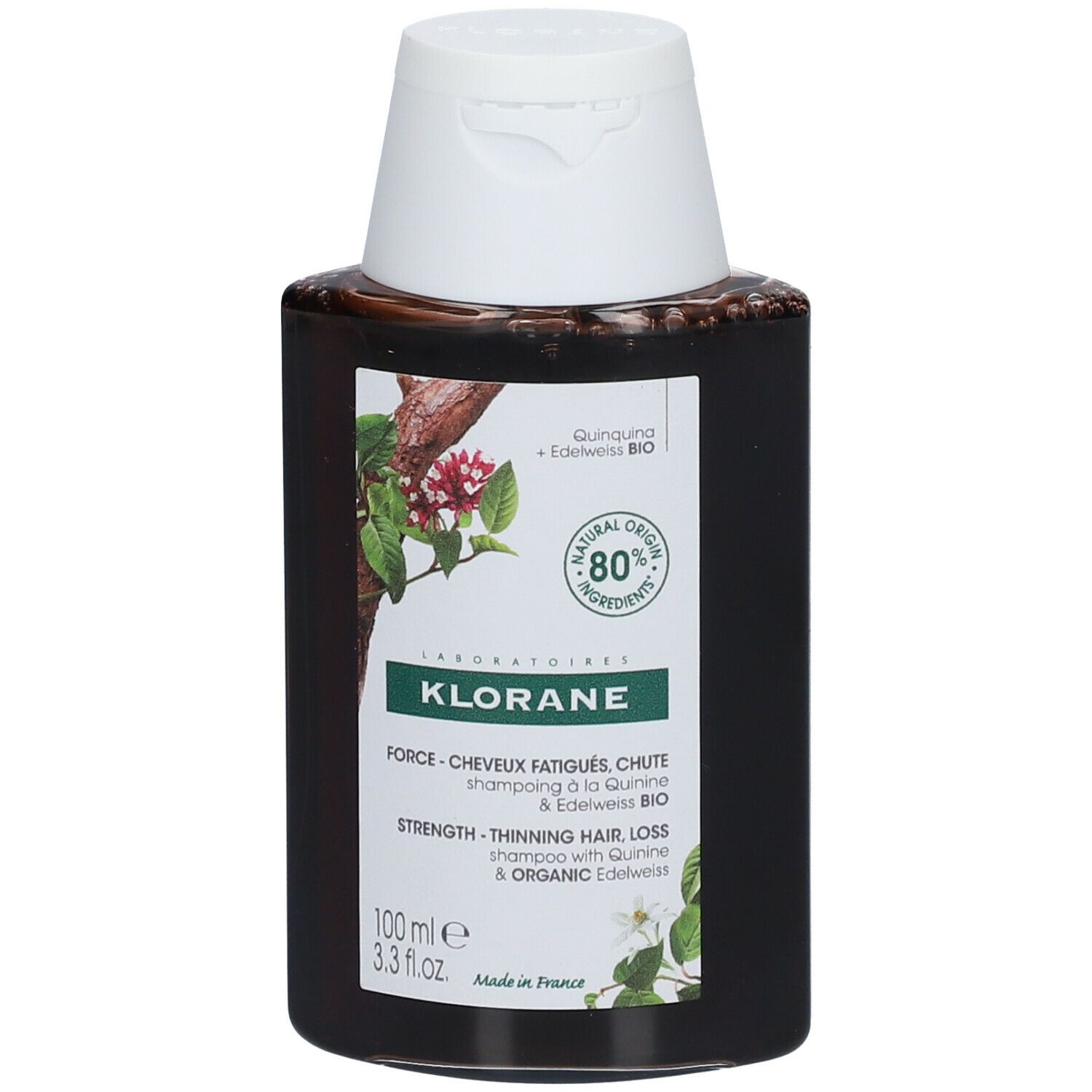 Flacon foncé avec bouchon blanc. Étiquette avec informations produit et logo. 80% ingrédients naturels.