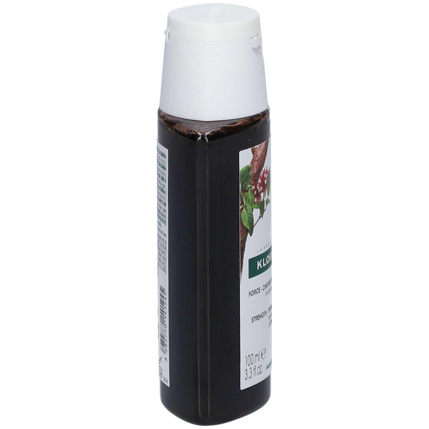 Flacon foncé, vue latérale. Bouchon blanc. Étiquette avec informations produit. Texte multilingue.
