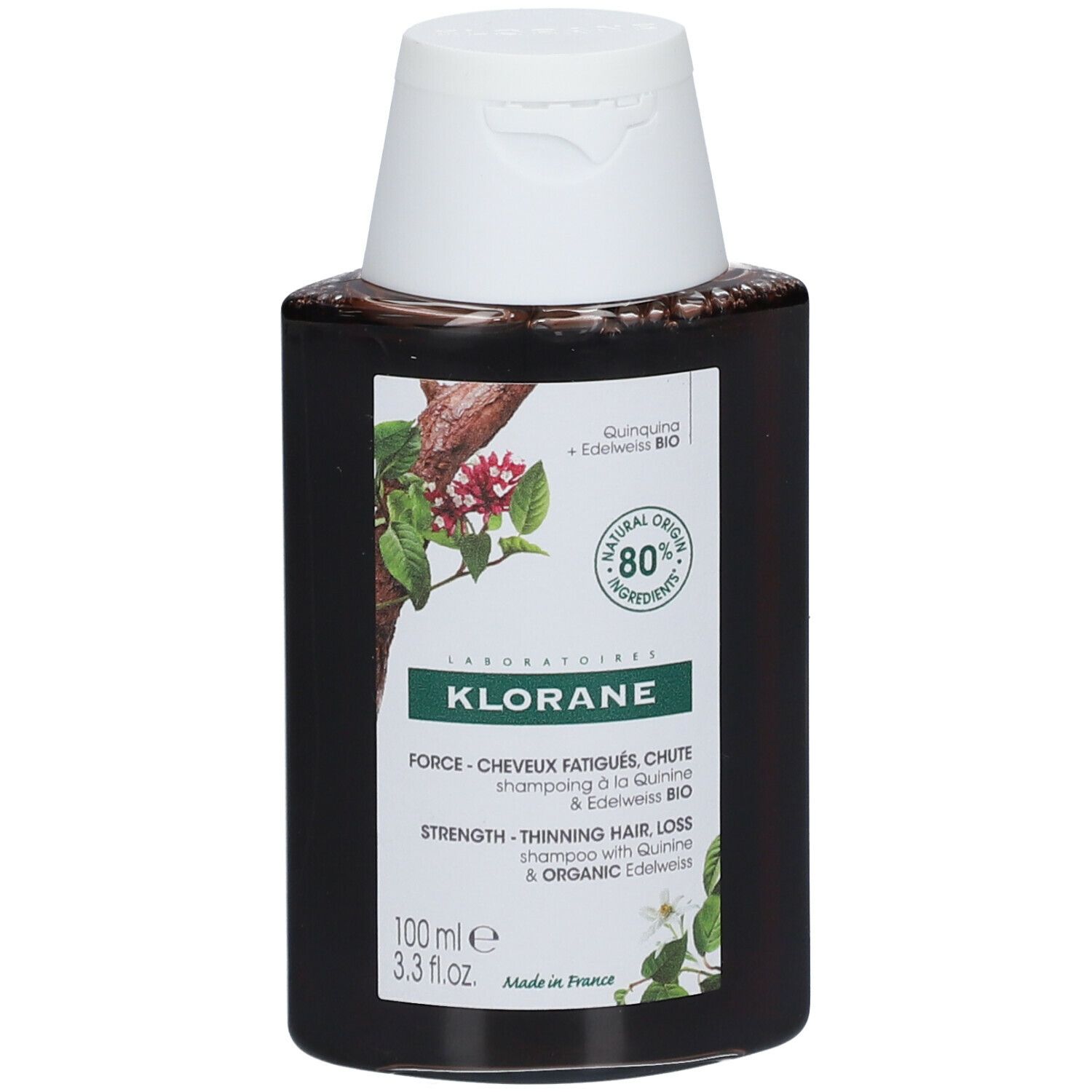 Flacon foncé avec bouchon blanc. Étiquette avec informations produit et logo. 80% ingrédients naturels.