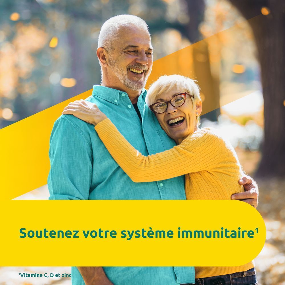 Un couple de personnes âgées s'embrassent et sourient. Texte : Soutenez votre système immunitaire.