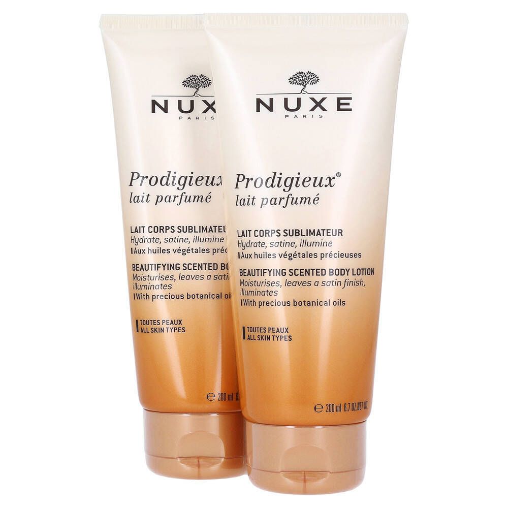 Twee tubes NUXE Prodigieux® bodylotion. Witgouden tubes met bruine doppen. Productnaam en tekst duidelijk zichtbaar.
