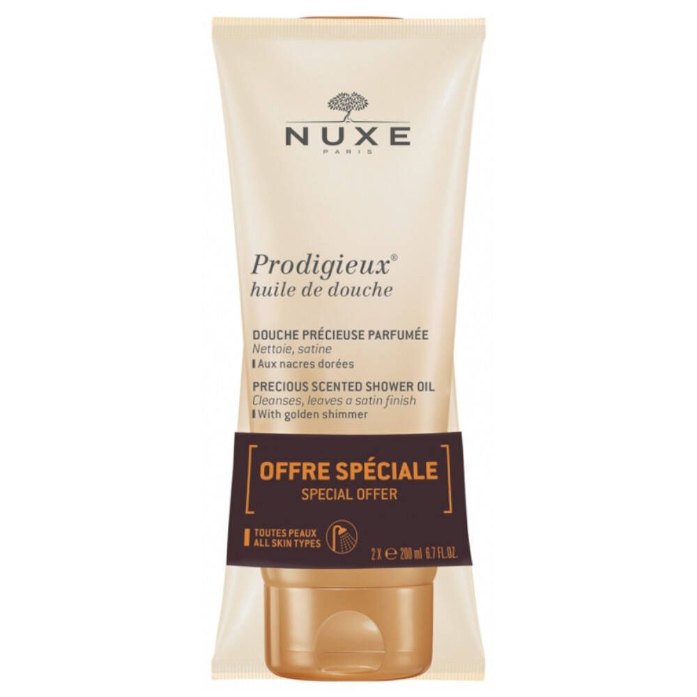 Tube beige et bouchon doré. Inscription: NUXE, Prodigieux huile de douche. Offre Spéciale.