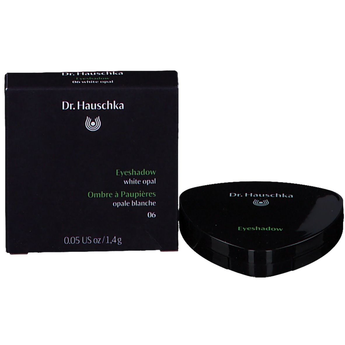 Emballage noir avec fard à paupières et informations sur le produit. Logo Dr. Hauschka.