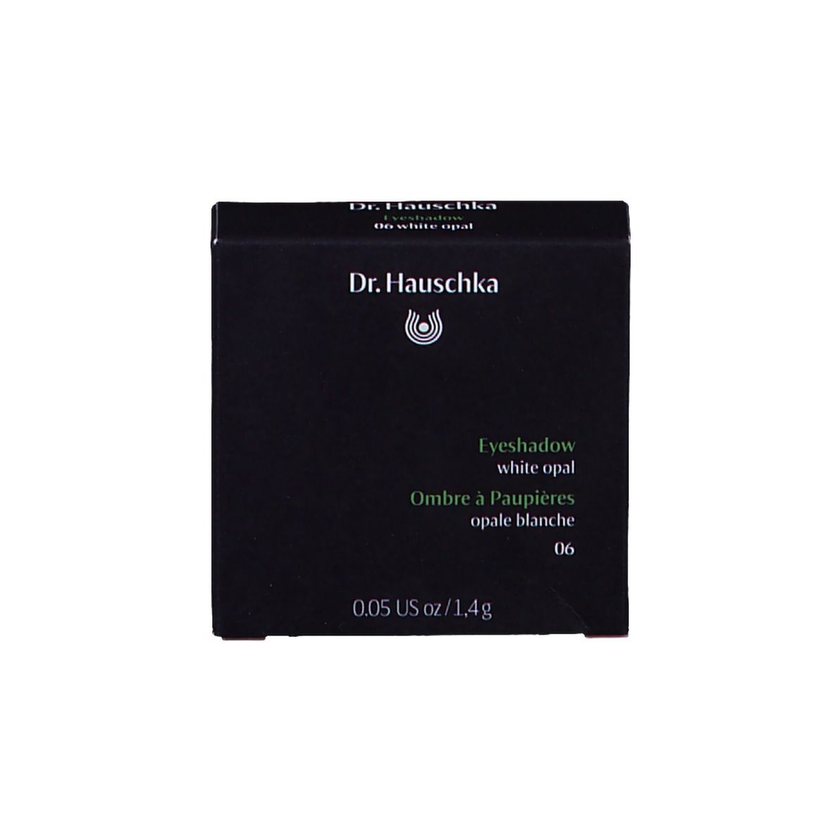 Emballage noir avec fard à paupières et informations sur le produit. Logo Dr. Hauschka.