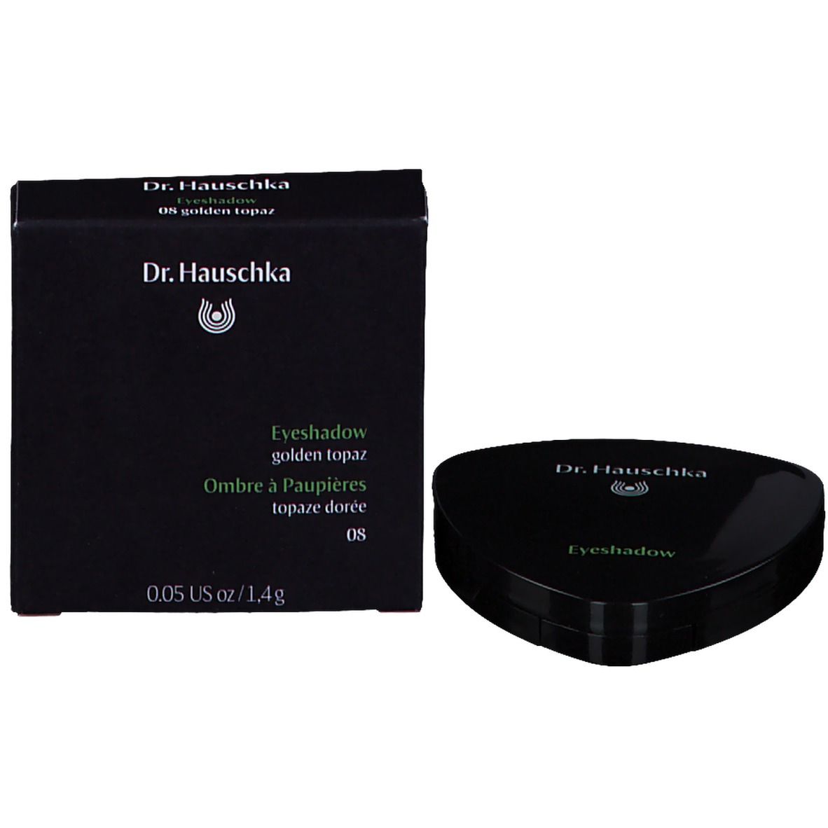 Emballage noir avec fard à paupières et poudre compacte. Inscription : Dr. Hauschka, Eyeshadow, golden topaz.
