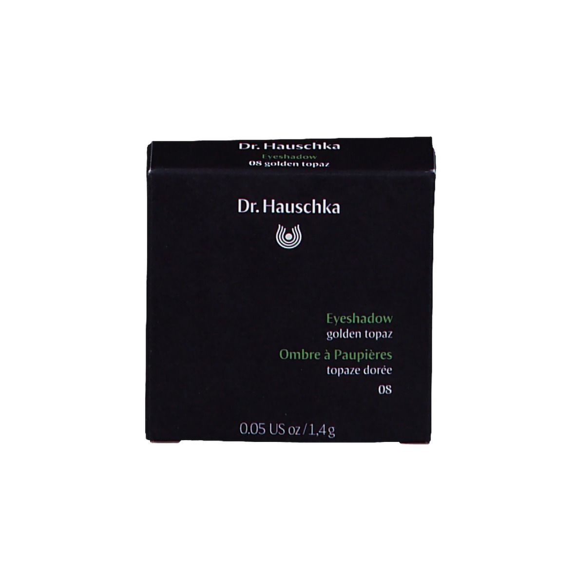 Emballage noir avec fard à paupières. Inscription : Dr. Hauschka, Eyeshadow, golden topaz.