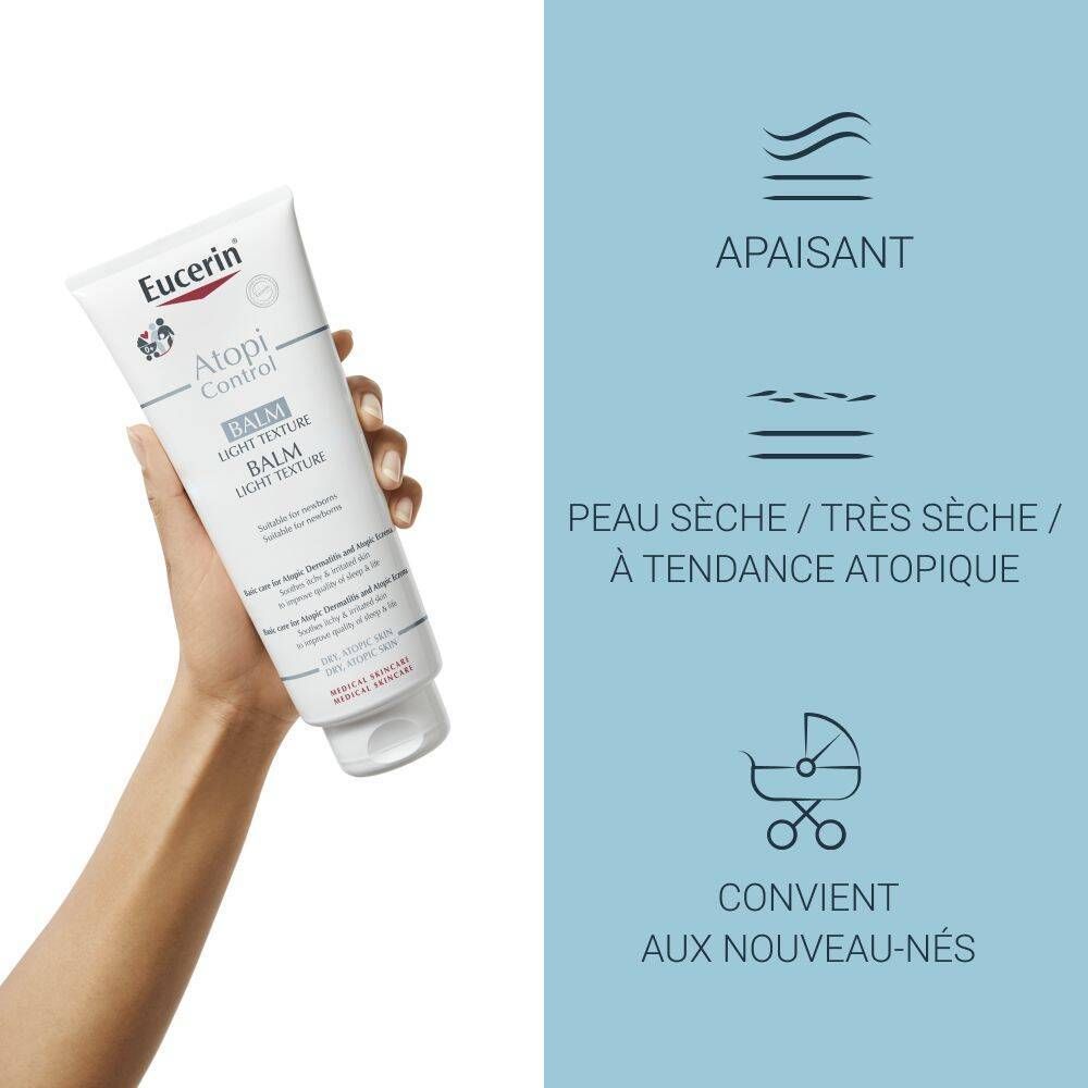 Main tenant tube de Baume Eucerin AtopiControl. Indications de texture et d'utilisation. Pour peaux sèches, atopiques, aussi pour bébés.