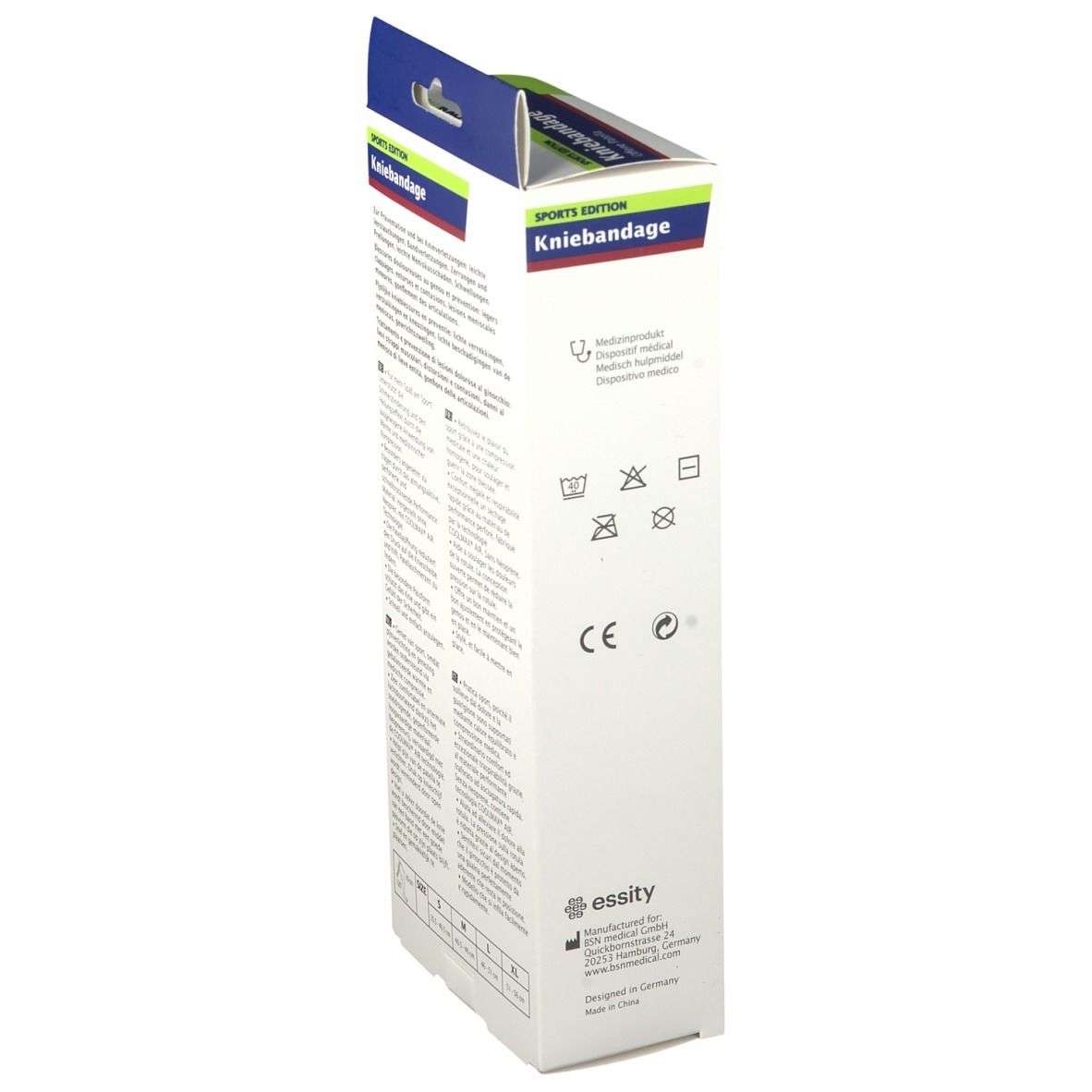 Seite der Actimove Kniebandage Verpackung. Text und Waschsymbole. Größenangaben: S, M, L, XL. CE-Kennzeichnung. Hersteller: essity.