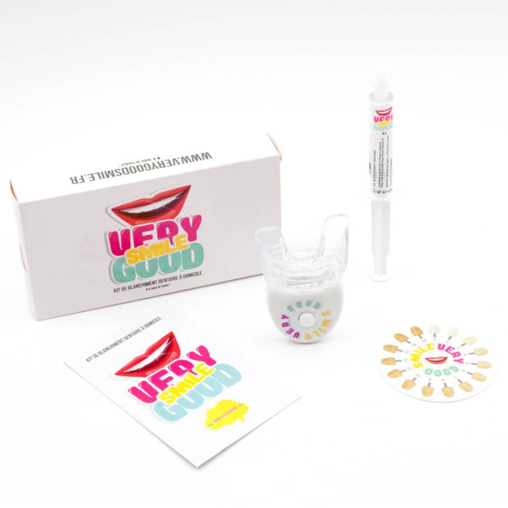 Zahnaufhellungs-Kit mit Zubehör. Enthält eine Box, eine Spritze, eine Schiene, eine Farbskala und eine Anleitung.