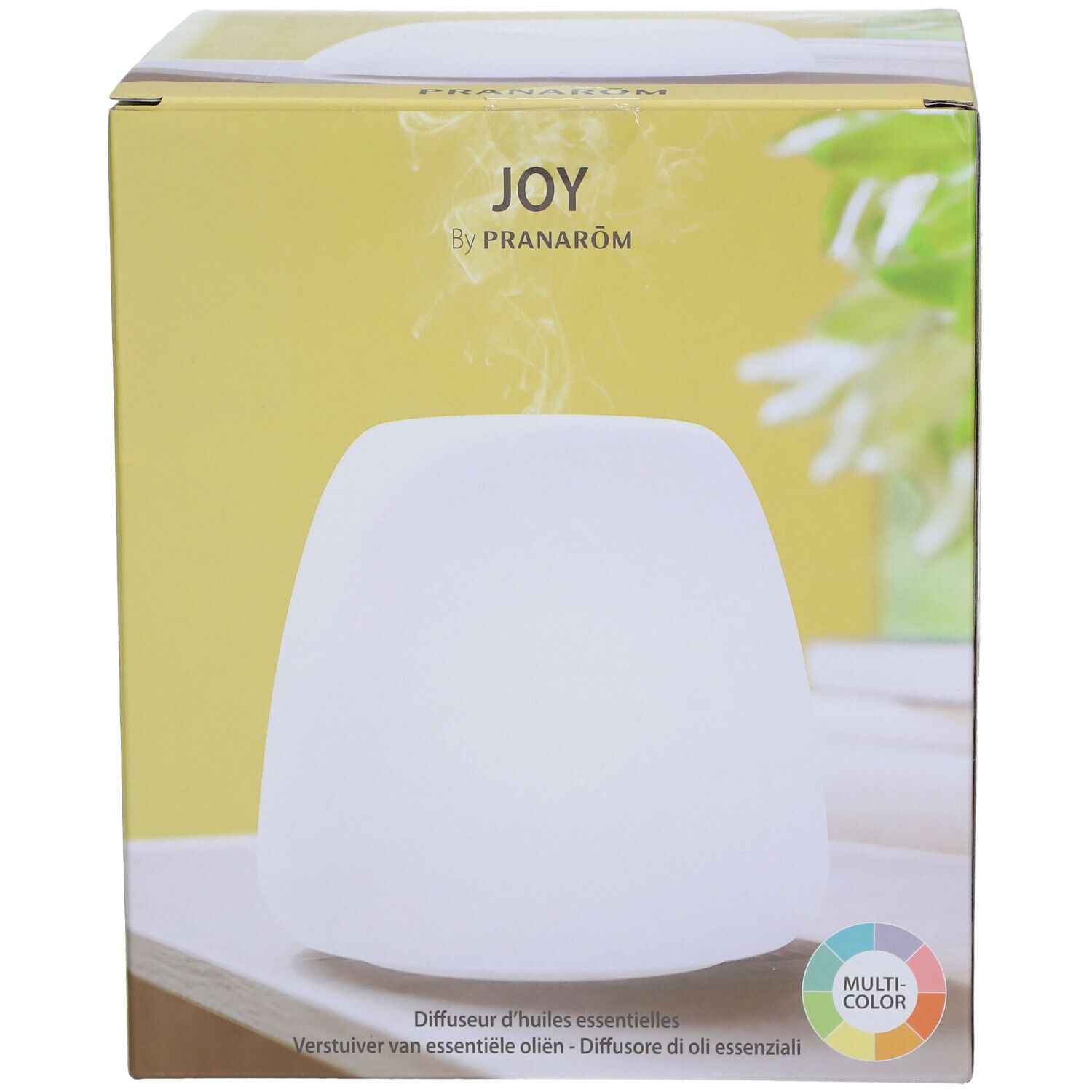 Verpakking met witte diffuser. Opschrift: JOY by Pranarôm. Meerkleurig licht.