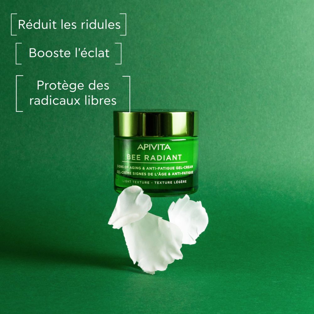 Pot de crème, pétales, texte. Réduit les rides, booste l'éclat, protège.
