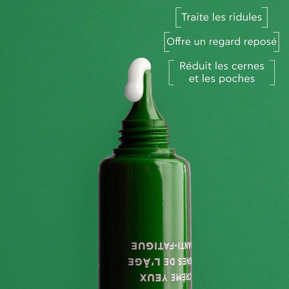 Tube vert avec crème. La crème sort du tube. Texte: Crème yeux anti-fatigue.