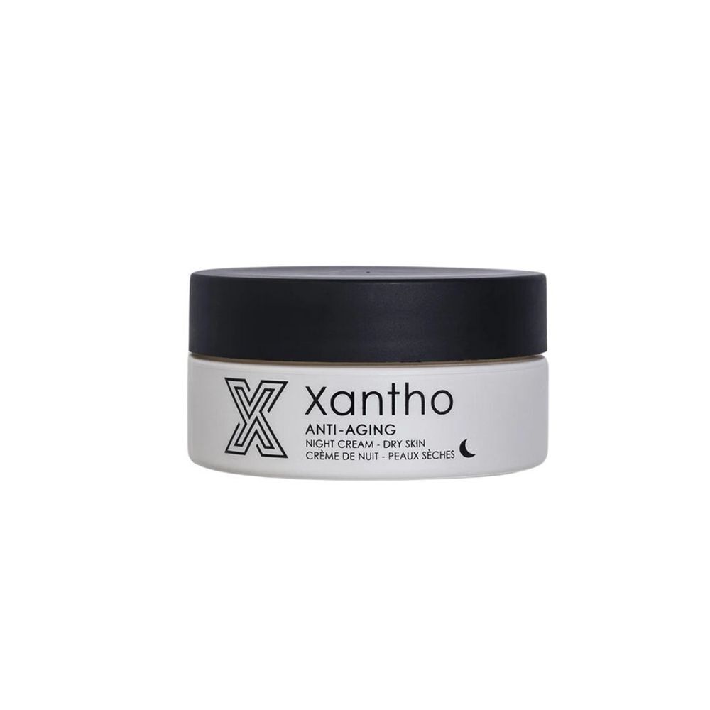 Crèmepot met zwarte deksel. Opschrift: Xantho, Anti-Aging, Nachtcrème, droge huid. Maansymbool.