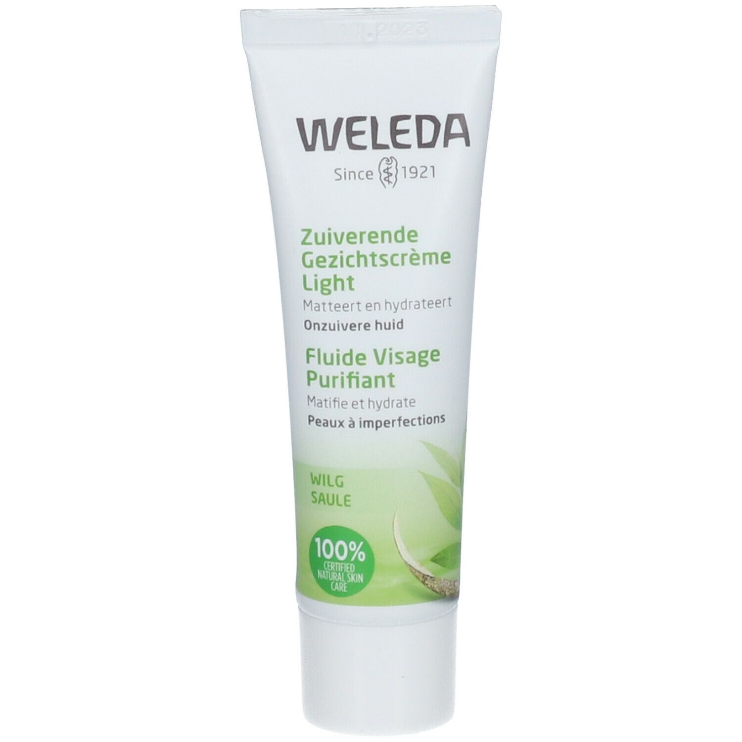Witte tube met groene opdruk. Tekst: Weleda, Zuiverende Gezichtscrème Light, Fluiide Visage Purifiant. Certificering.