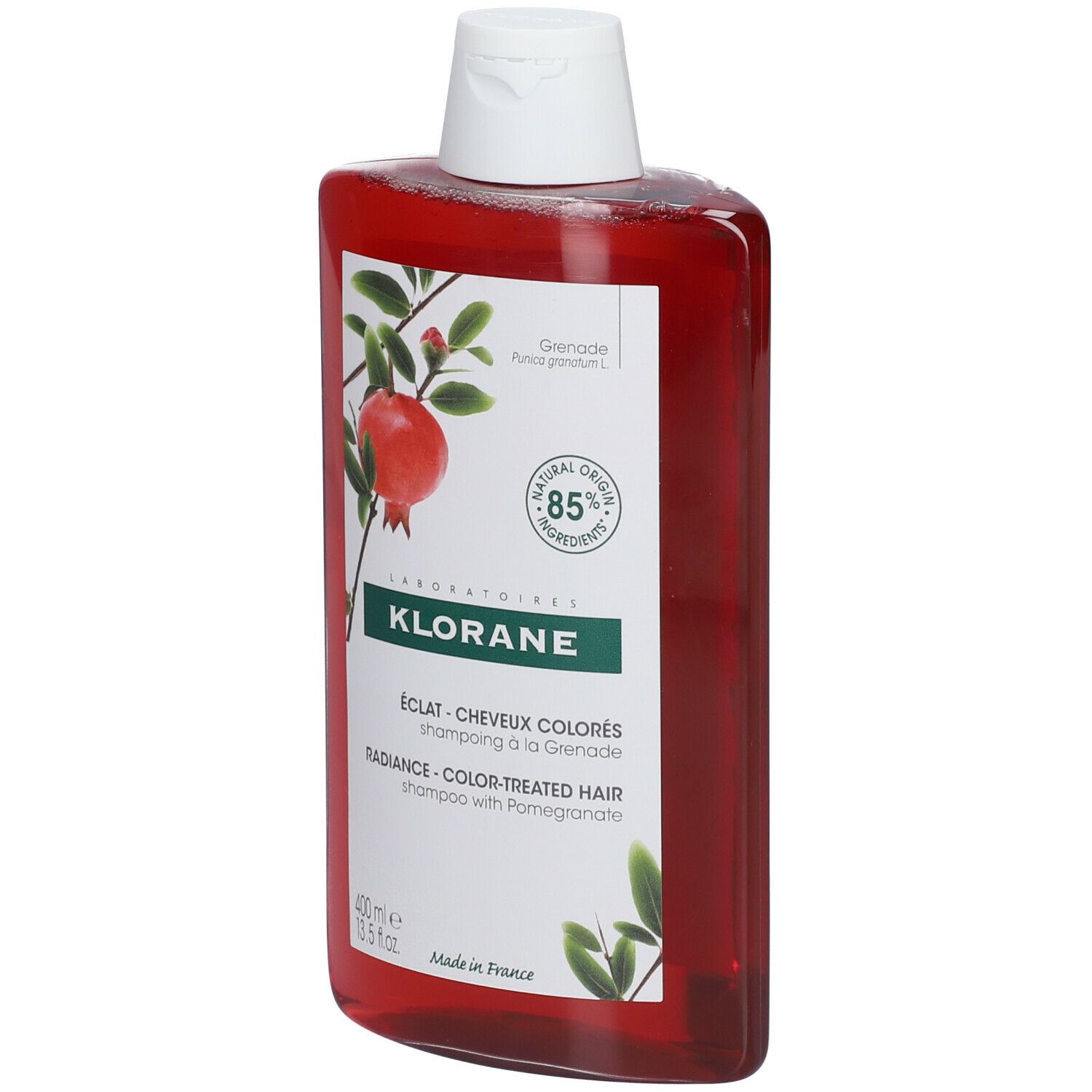 Klorane granaatappel shampoo. Rode, rechthoekige fles met witte dop. Etiket met granaatappel illustratie en tekst.