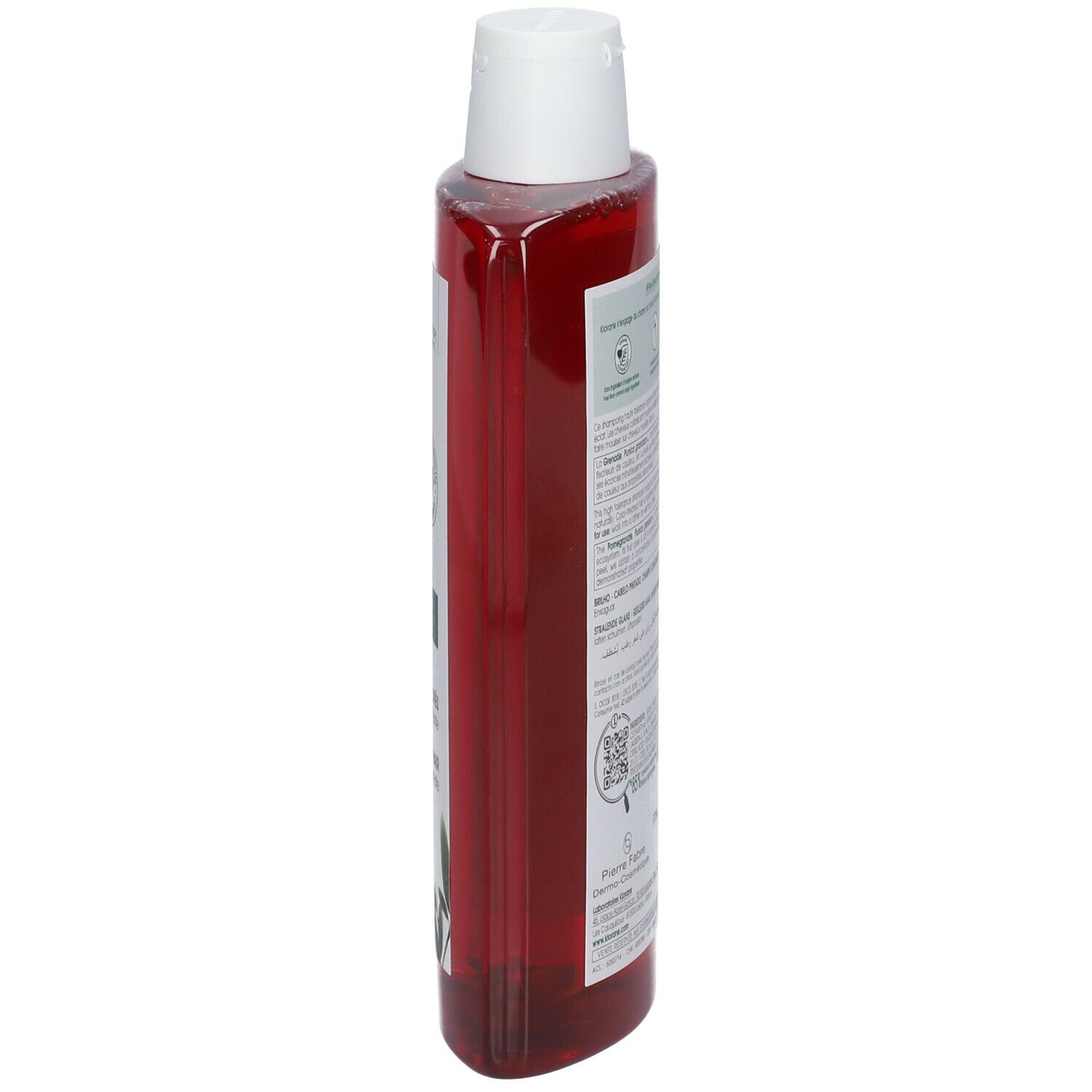 Klorane granaatappel shampoo. Zijaanzicht van de rode fles met witte dop en etiket.