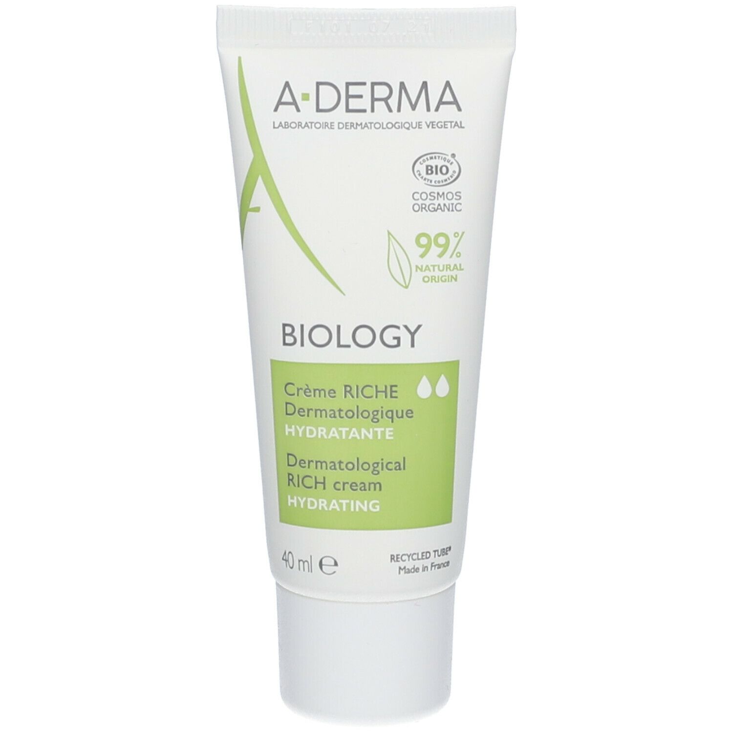A-Derma Biology crème tube. Wit met groene accenten. Tekst: Biology, Crème Riche, Dermatologique Hydratante, 99% natuurlijke oorsprong.