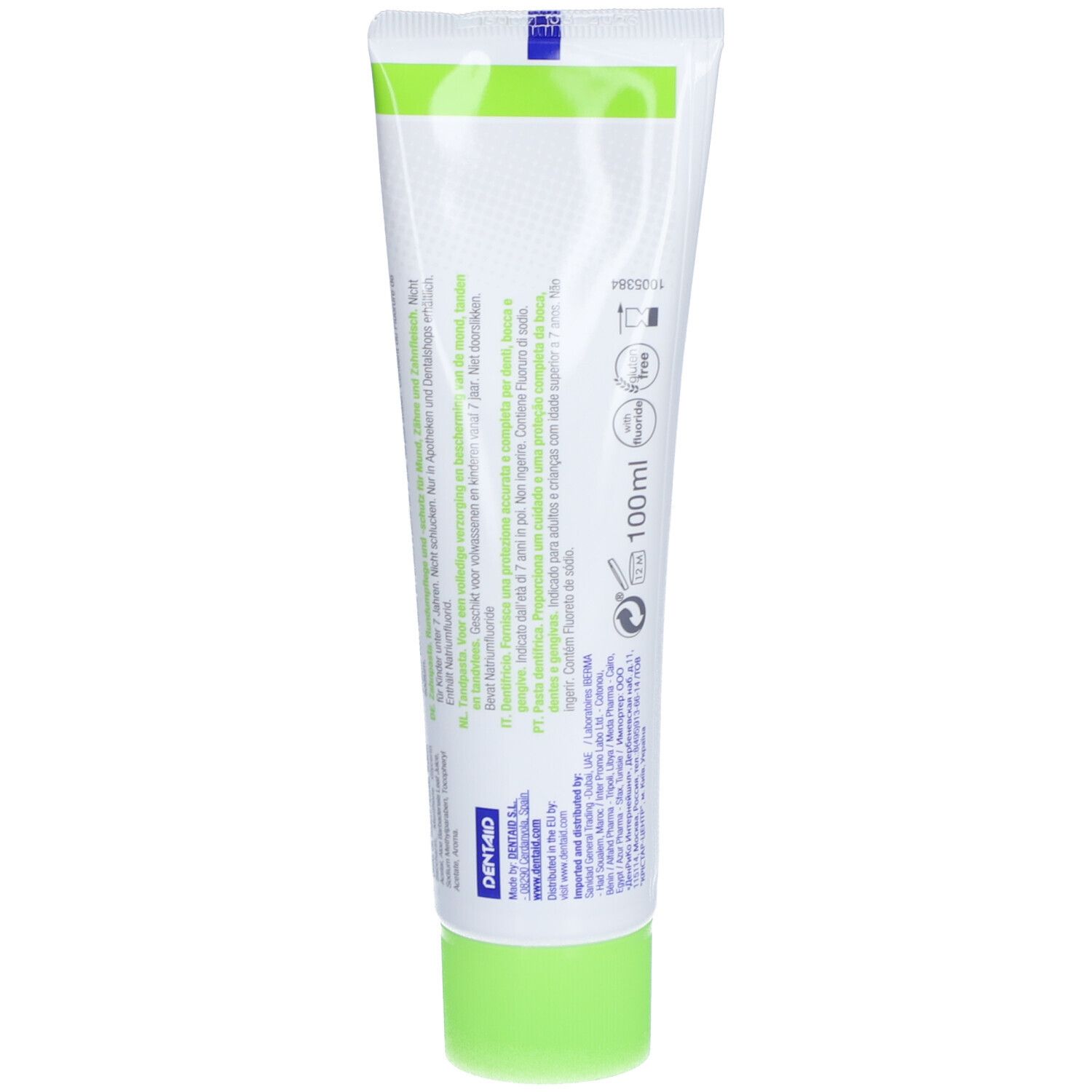 Dos du tube de dentifrice. Texte multilingue. Couleurs vert et blanc. Informations fabricant.