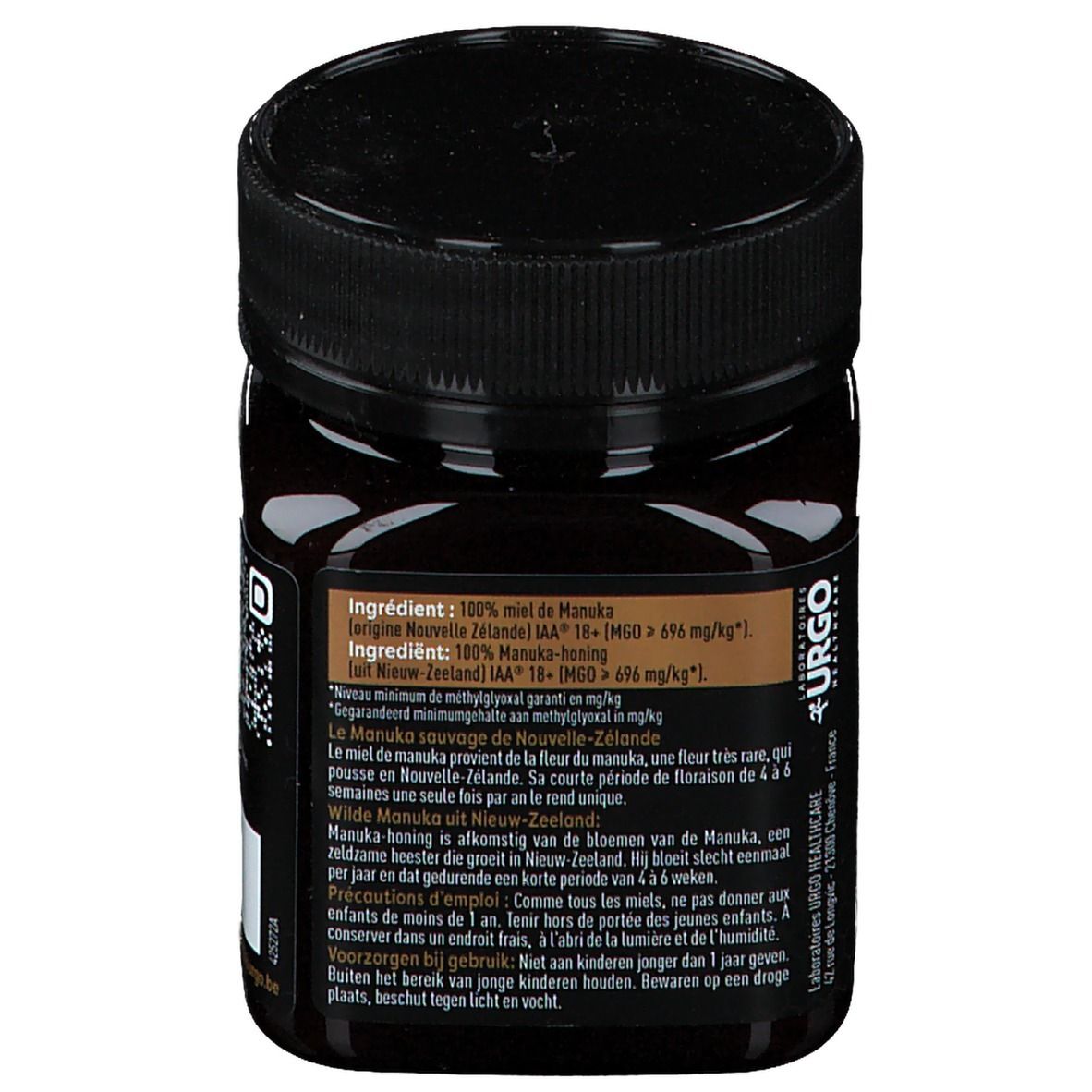 Achterkant van de pot. Ingrediëntenlijst: 100% Manuka honing. Waarschuwingen. Fabrikantinformatie.