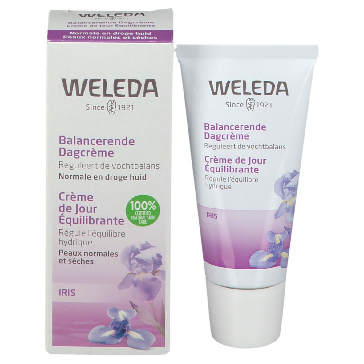 Weleda-verpakking en tube. Verpakking: wit, paarse accenten, tekst. Tube: wit, paarse accenten, tekst. 100% natuurlijke verzorging.