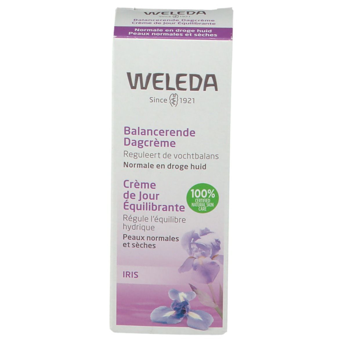 Weleda-verpakking. Wit, paarse accenten, tekst. Opschrift: Balanceerende Dagcrème, Crème de Jour Équilibrante. 100% natuurlijke verzorging.