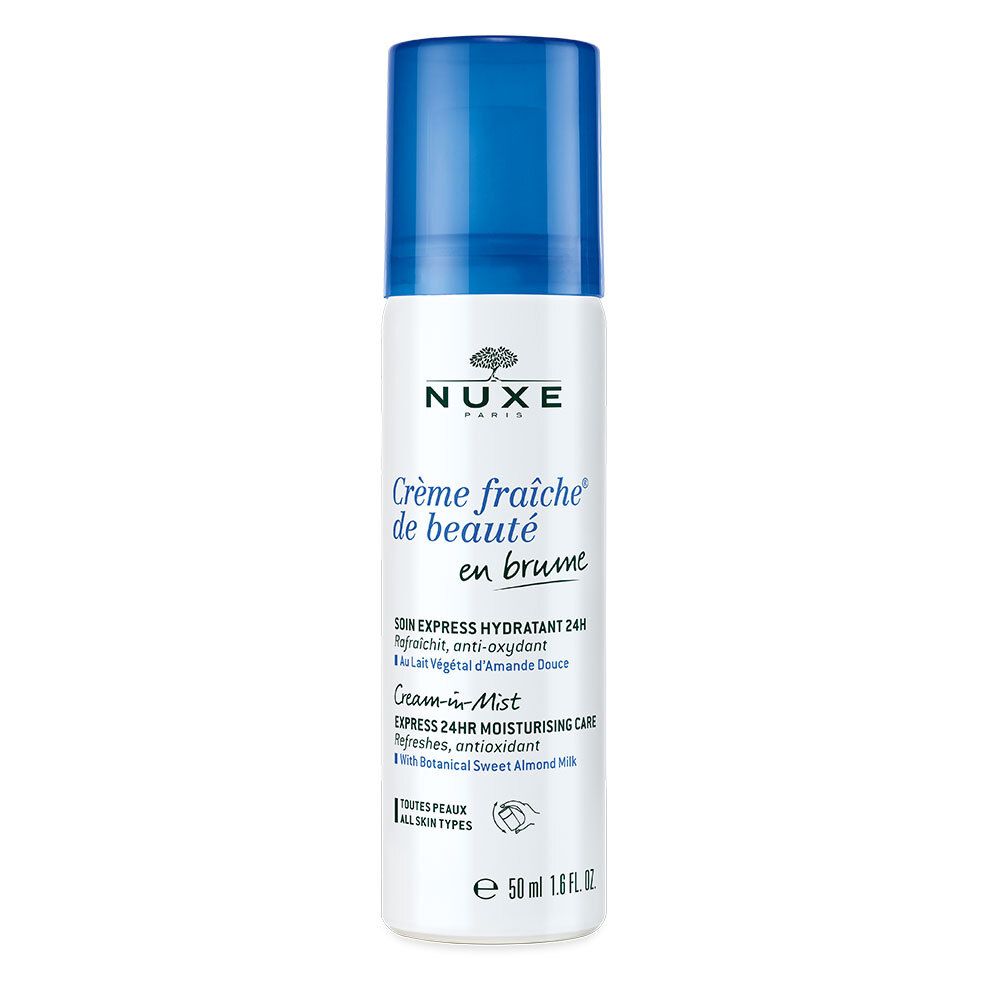 Flacon vaporisateur blanc et bleu. Inscription: Nuxe, Crème fraîche de beauté en brume. Contenance: 50 ml.