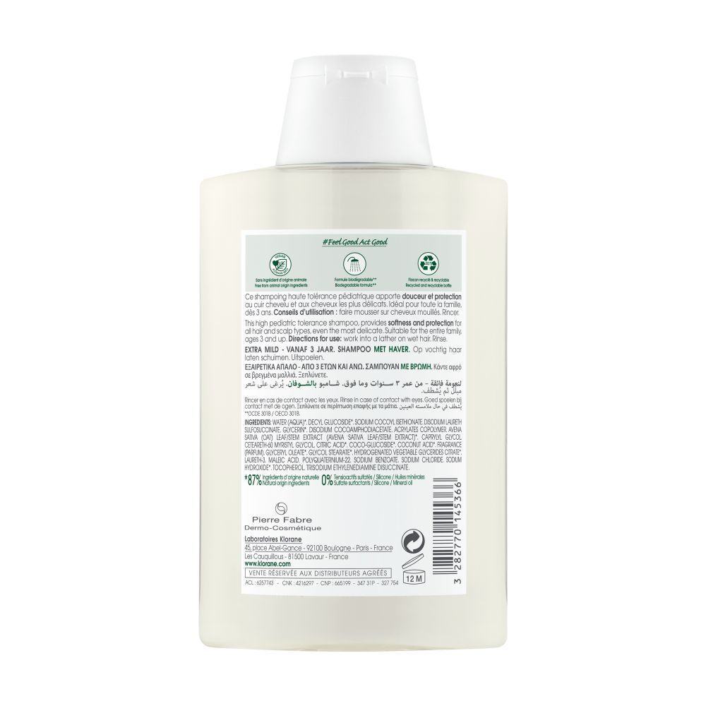 Flacon de shampooing Klorane. Face avant avec nom du produit, logo et ingrédients. Design blanc avec bouchon blanc.
