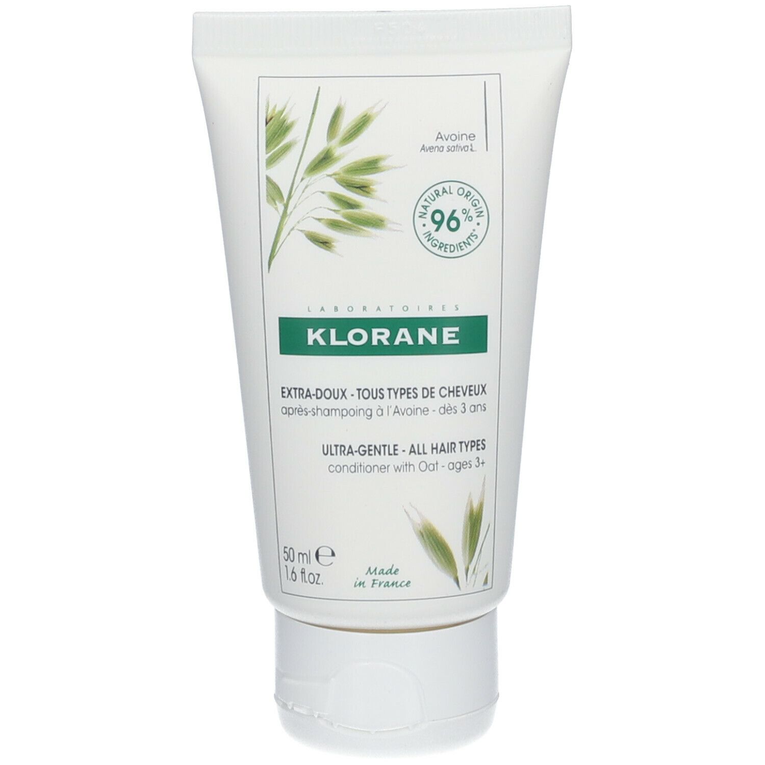 Tube blanche avec impression verte. Contient KLORANE, illustration d'avoine et texte. 96% d'ingrédients d'origine naturelle.