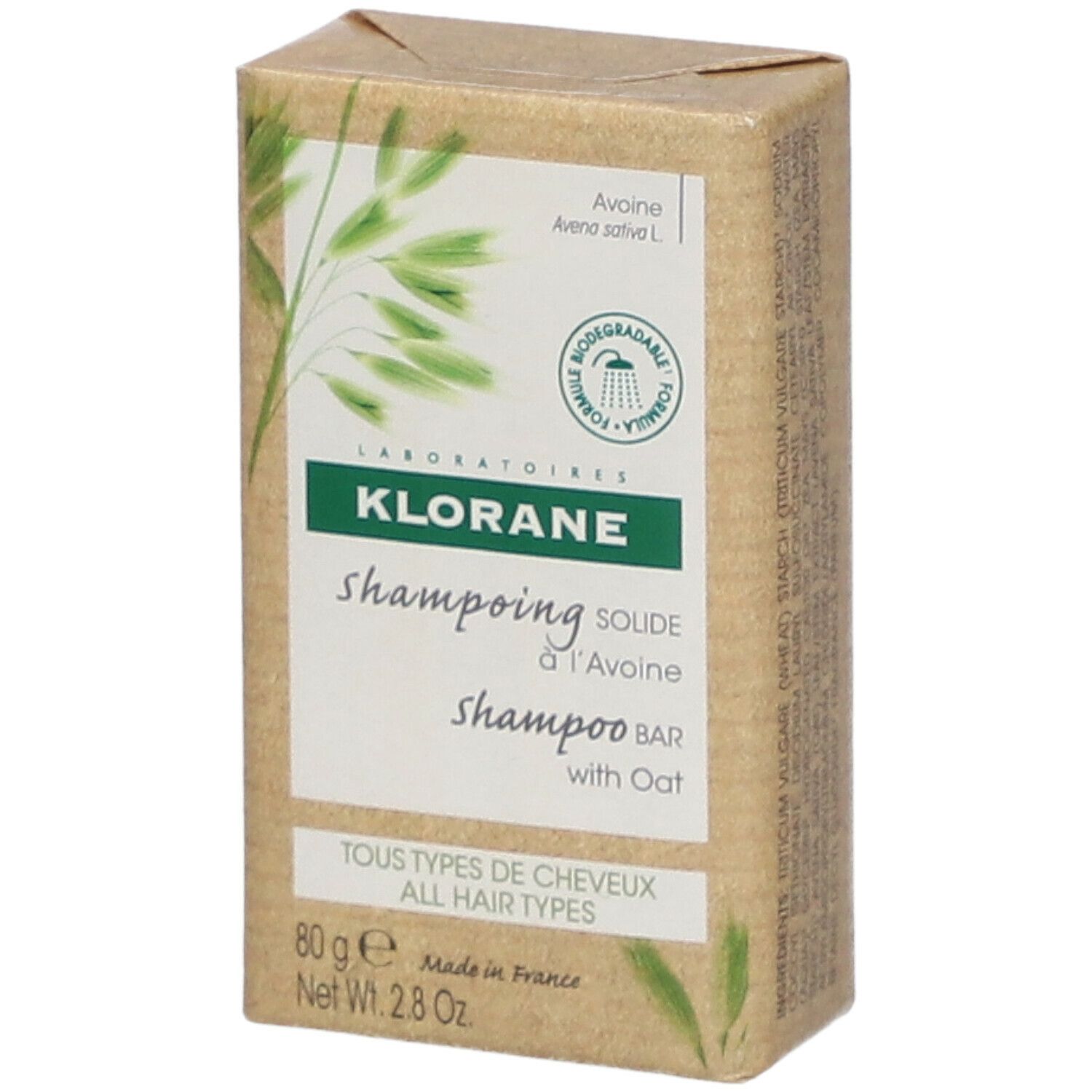 Klorane Shampoo Bar. Rechthoekige verpakking van bruin papier. Opschrift: Shampooing solide à l'Avoine, met haver. Alle haartypes.