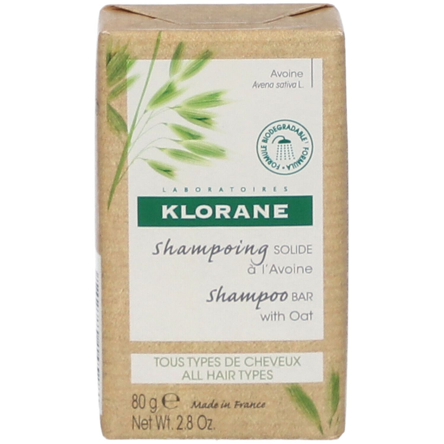 Klorane Shampoo Bar. Rechthoekige verpakking van bruin papier. Opschrift: Shampooing solide à l'Avoine, met haver. Alle haartypes.