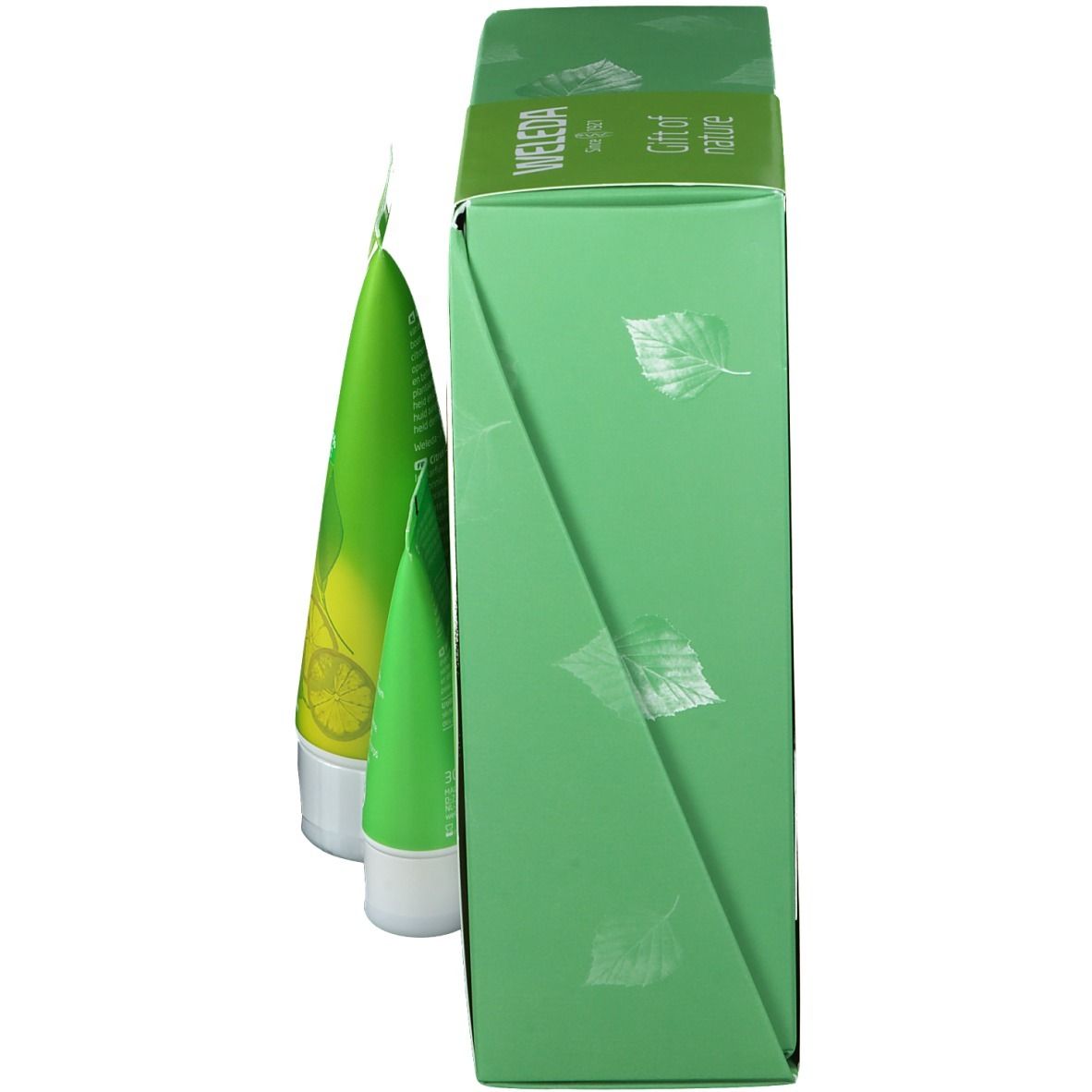 Groene doos met drie tubes. Opschrift: WELEDA. Bladeren patroon. Zijaanzicht.