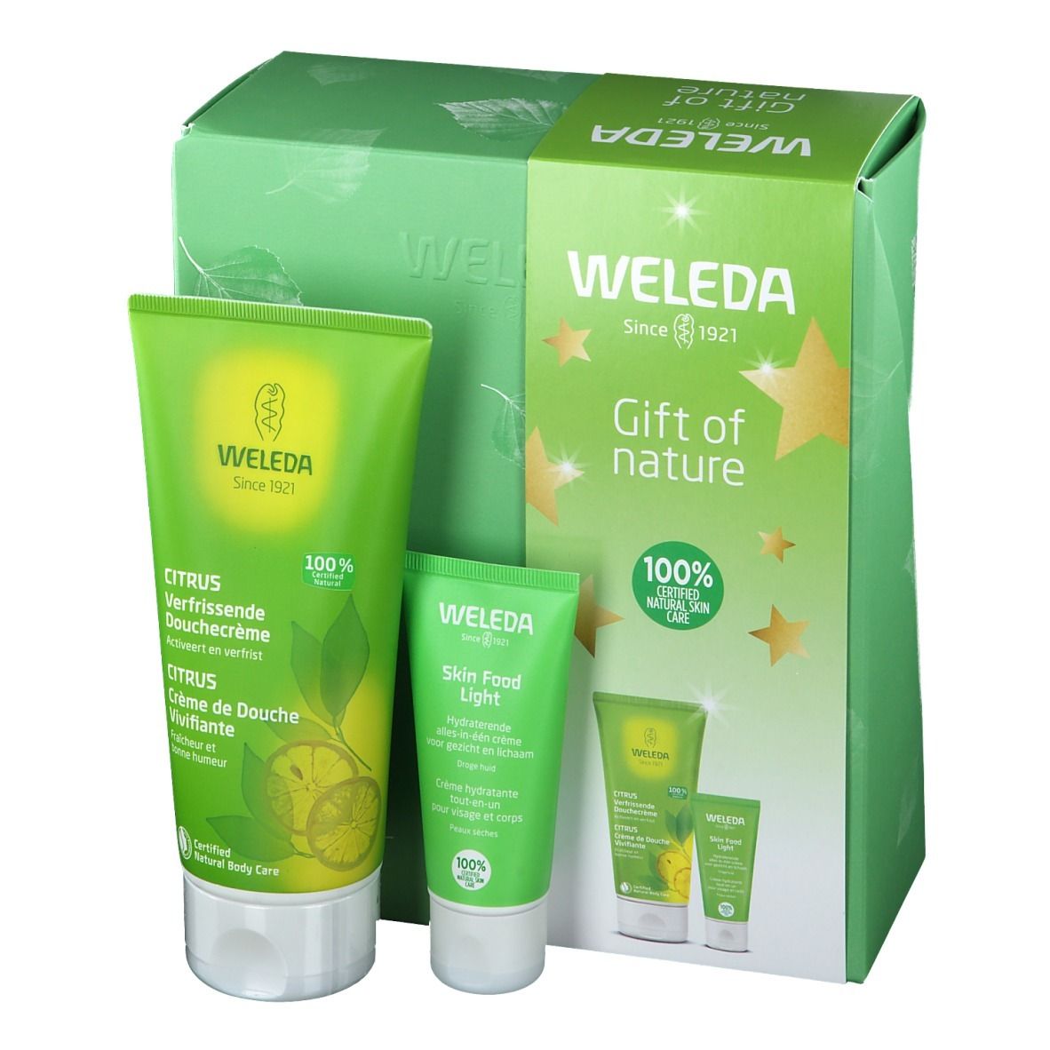 Geschenkset met twee tubes en een doos. Opschrift: WELEDA, Citrus, Skin Food Light. Groen en wit.