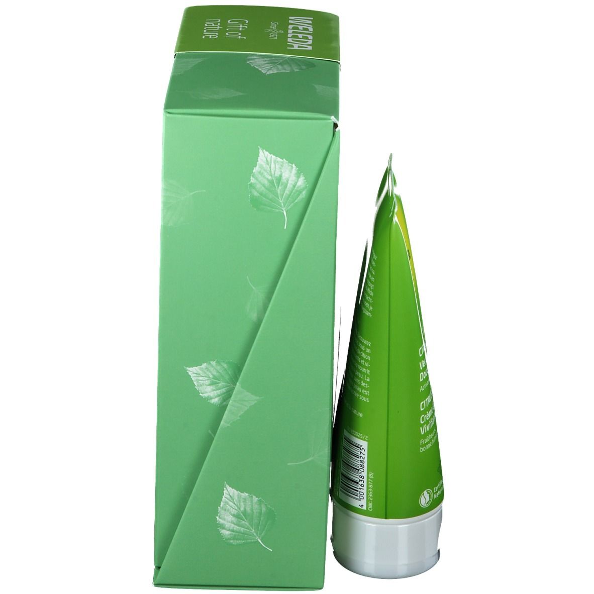 Groene doos met een tube. Opschrift: WELEDA. Bladeren patroon. Zijaanzicht.